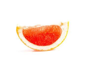 Orange-red grapefruit in a cut on a white background. close up