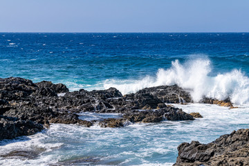 Rocky volcanic coastline at Mirador Playa Los Guirres, La Palma, Canary Islands, Spain