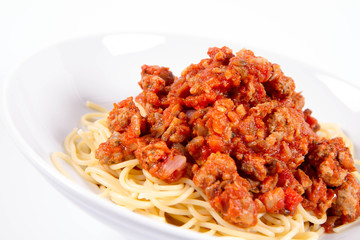 Spaghetti bolognese on a plate on a white background	