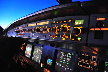 Cockpit of an Airbus A320 in cruise from the first officer seat - obrazy, fototapety, plakaty