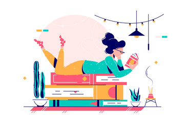 Cute lady lying on stack of books