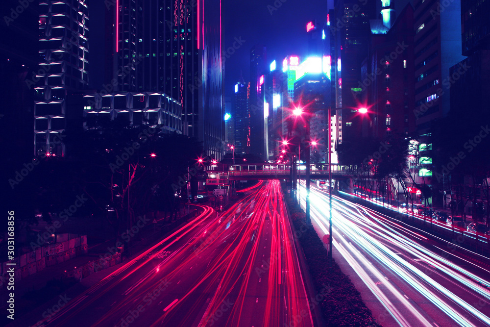 Wall mural night time car trails in hong kong with a retro outrun color effect