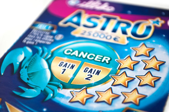 Mulhouse - France - 16 November 2019 - Closeup of astro scratch ticket on white background