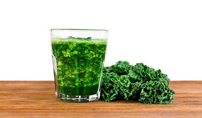 Fresh kale leaf and kale smoothie isolated on a white background.