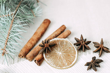 spices for Christmas baking and drinks: dried lime, cinnamon and ginger