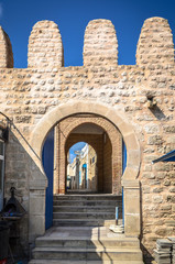 Fototapeta na wymiar Beautiful gate in the defensive walls of Monastir, Tunisia.