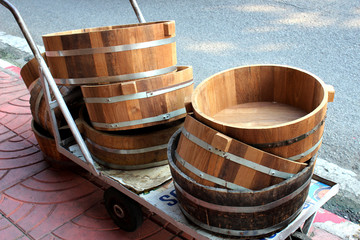 Naklejka premium Wooden tubs placed on three wheeled cart