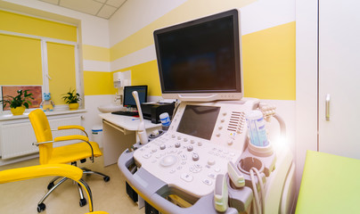 The workplace of a sonographer. Cabinet of ultrasound diagnostics, medical equipment background,Hospital interior.