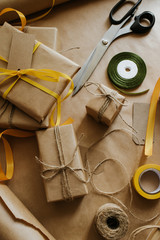 Gift box packaging. Kraft wrapping paper and natural twine. Recycling material. Happy holiday present, surprise. Gifts for boxing day. Delivery service, shipping. Handwork art craft. Celebration event