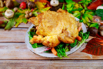 Roasted turkey with corn and lettuce on plate.