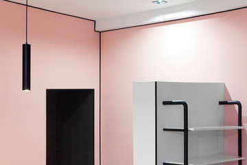 Minimal interior design.Modern hanging lamp, pink wall. Copy space