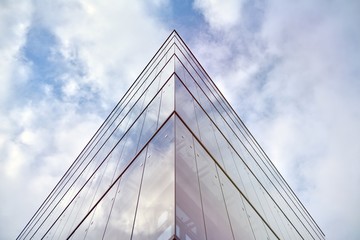 Sky reflected in a modern building glass facade