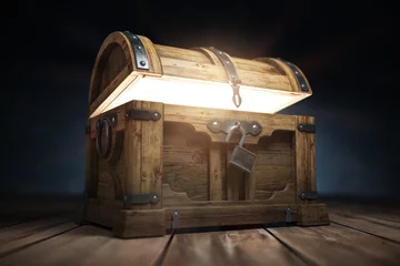 Fotobehang Old wooden treasure chest box with  glow from inside © Maksym Yemelyanov