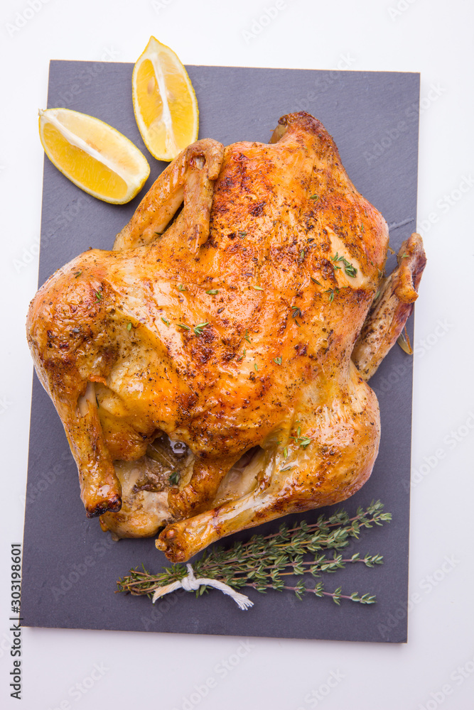 Sticker Homemade roasted chicken with lemon on white