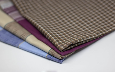 Brown cloth in a cage on a wooden table