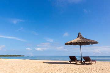 Back view of Sun bed in a beach on a sunny day