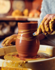 Pottery workshop. A senior man makes a vase of clay. Clay modeling