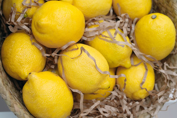 Wicker basket with lemons.