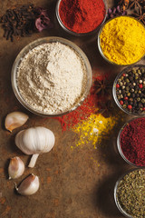 Dried Garlic. Place for text. Different types of Spices in a bowl on a stone background. The view from the top