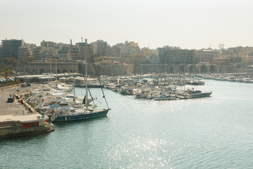 Yachts and boats stand on the pier in the port. Heraklion, Greece