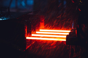 hot steel on conveyor in steel mill