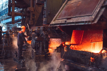 Workers in the steel mill.