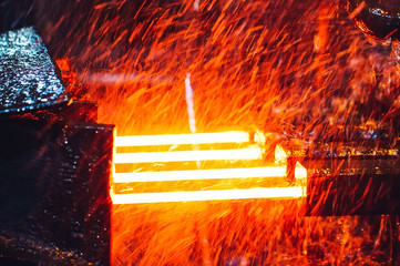hot steel on conveyor in steel mill