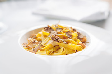 Pasta with truffles, typical autumn dish.Restaurant menu dish.