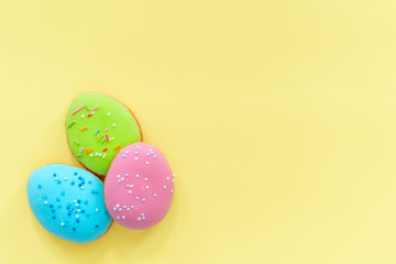 Easter gingerbread on yellow background. Easter sweets fo celebrate. 