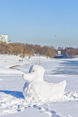 Snow duck sculpture in the winter park