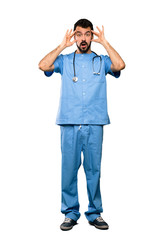 Full-length shot of Surgeon doctor man with surprise expression over isolated white background