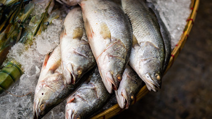Fish on ice waiting to be sold in an asian streetmarket    