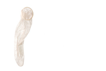 Unrroled used latex condom isolated on white background. copyspace.