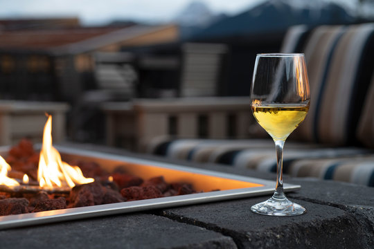 One Glass Of Wine Next To A Fire Pit With A Mountain View