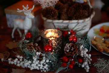 Fototapeta na wymiar Christmas gifts, lights, candles and sweets
