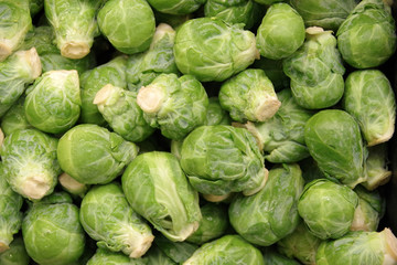 Fototapeta na wymiar Close-up full frame view of organic Brussel Sprouts displayed at a market stand