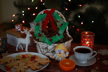 Christmas wreath with gifts and sweets with deer and orange