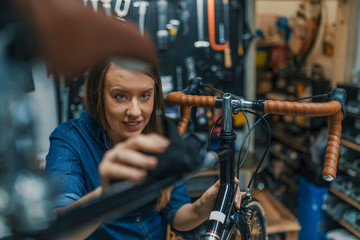 Fototapeta na wymiar Women wipes bicycle