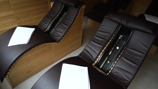 Panning Shot Of Massage Chairs In A Masseuse Treatment Spa, top view
