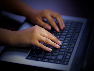 laptop keyboard typing hands