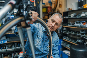 Fototapeta na wymiar Repair technician bicycles was repaired gear bike shop.