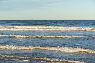 Fototapeta premium Foamy mediterranean sea waves on Valencia city beach