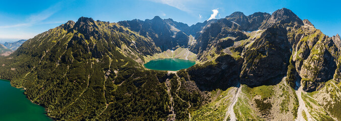 Panorama Aerial view of Black Lake below Mount Rysy. It overlooks the nearby lake of Morskie Oko, or Eye of the Sea in Tatra Mountains, in southern Poland - obrazy, fototapety, plakaty