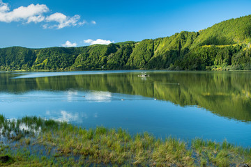 A beautiful and scenic view of Lagoa das Furnas (Furnas Lake) that fills a crater located in...