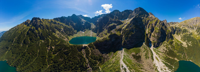 Panorama Aerial view of Black Lake below Mount Rysy. It overlooks the nearby lake of Morskie Oko, or Eye of the Sea in Tatra Mountains. Poland country