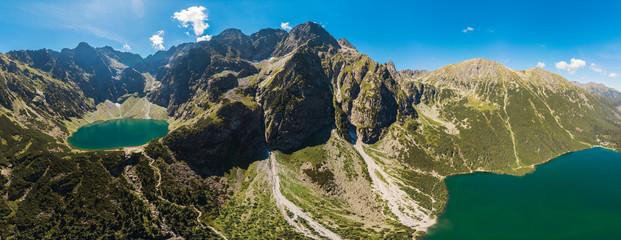 Panorama Aerial view of Black Lake below Mount Rysy. It overlooks the nearby lake of Morskie Oko, or Eye of the Sea. Tatra Mountains. Poland country - obrazy, fototapety, plakaty