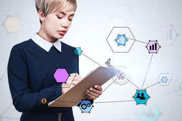 Woman with clipboard and her business plan