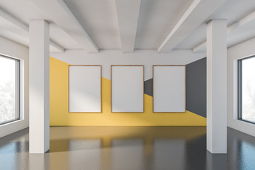 Empty yellow and gray room with poster gallery