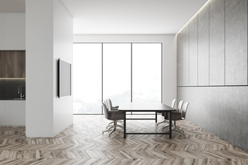 White dining room and kitchen with TV