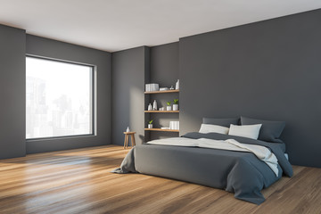 Modern gray bedroom corner with bookshelves